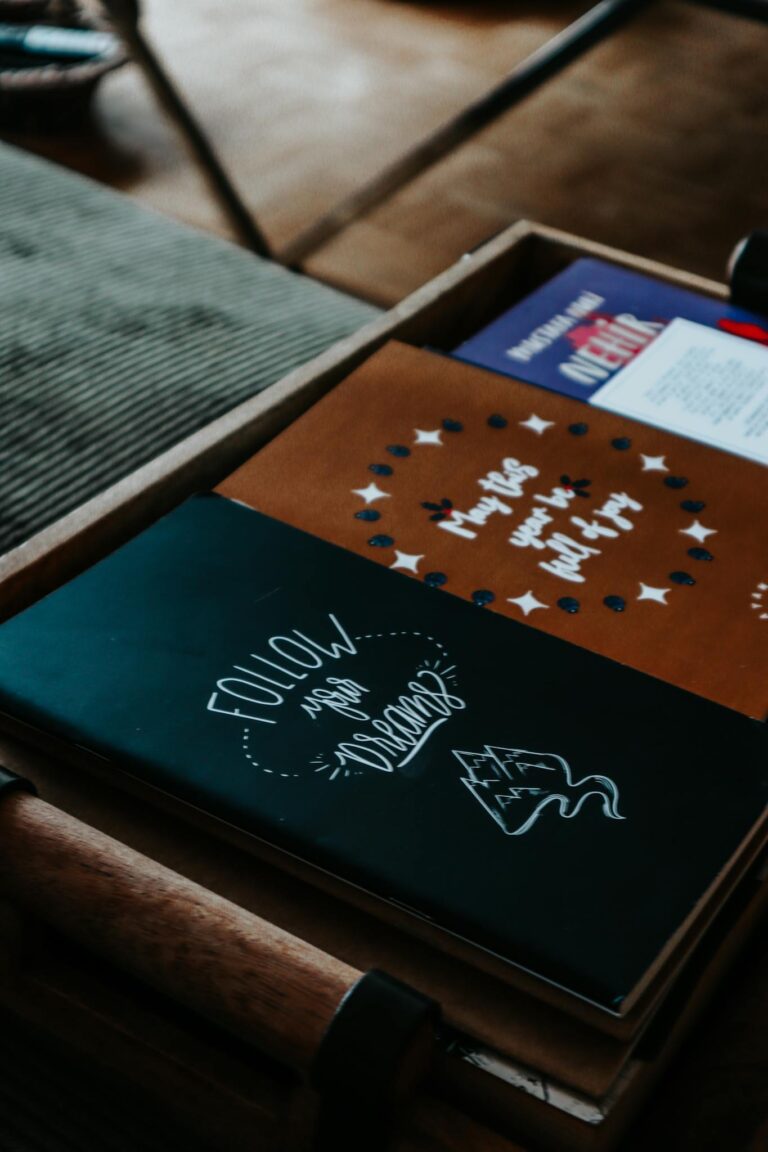 Close-up view of colorful and inspiring notebooks with motivational quotes.